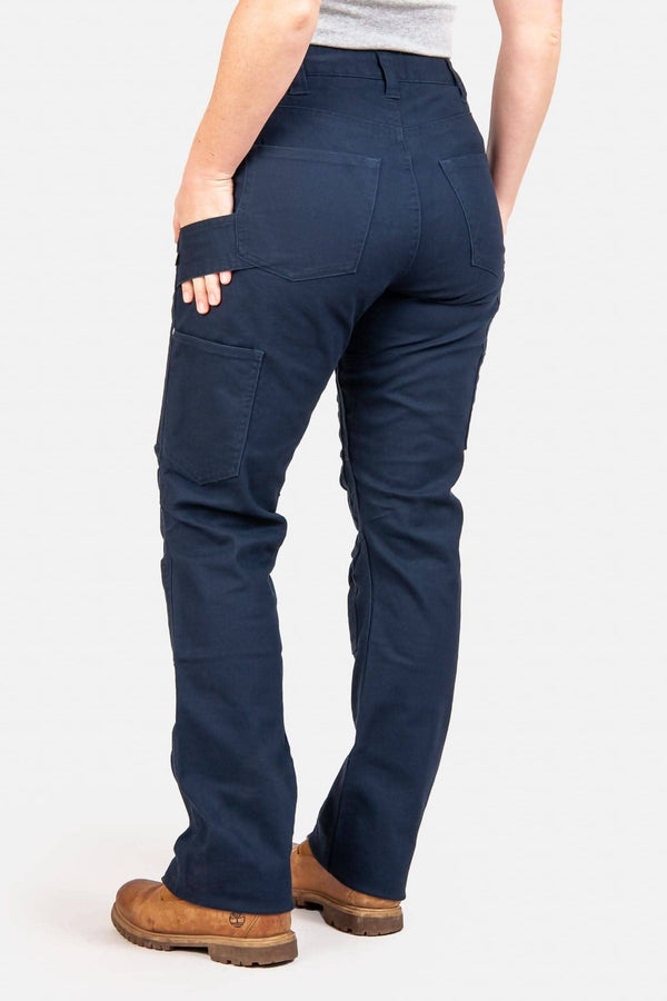 Back view of a woman wearing Dovetail Workwear Anna Taskpant in Uniform Navy Canvas, showcasing the relaxed leg fit, nested pockets, and crotch gusset detail