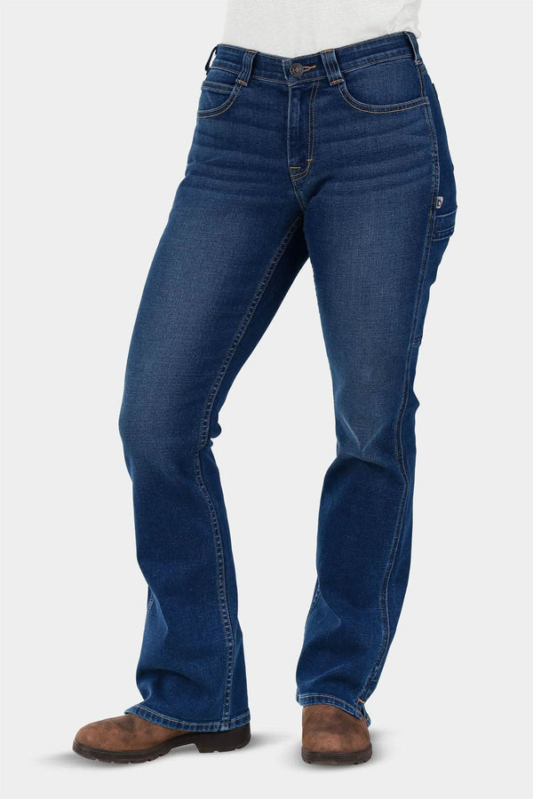 John Deere X Dovetail Workwear Into Town Bootcut Jeans in Classic Indigo Blue worn by a woman, shown from the front with brown boots, featuring a mid-rise waist and bootcut silhouette
