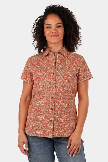 Dovetail Workwear Carver Work Shirt in paprika with paisley print, short sleeves, button front, and chest pockets, worn by a woman against a white background