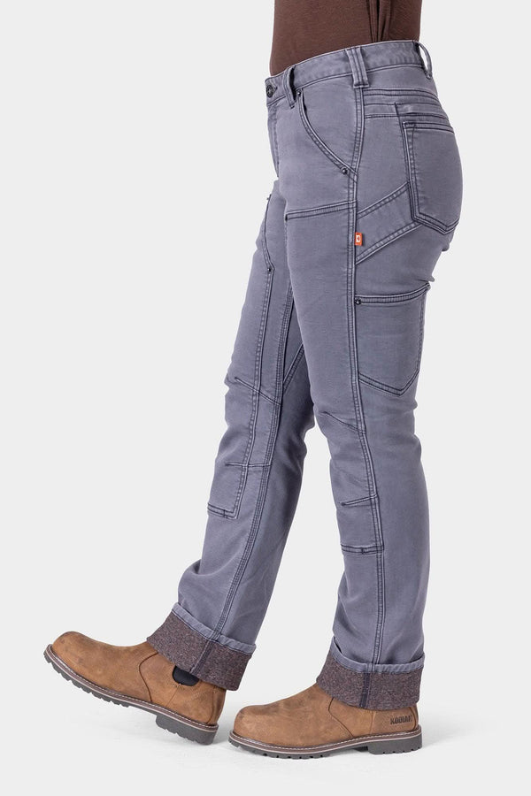 Side view of insulated Britt Utility HOTSWAP™ Pants in grey, showing articulated knees and tool loop for functional winter workwear.