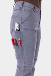 Close-up of utility pockets on grey Britt Utility HOTSWAP™ Pants holding tools, highlighting functional design for active work environments.
