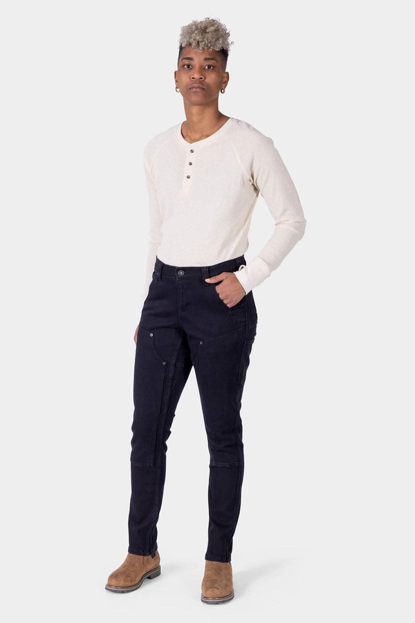 Maven X Graphene Denim Pant in Black by Dovetail Workwear, slim-fit carpenter style shown on a woman with visible crotch gusset and tool loops