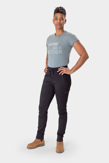 Model wearing Christa X DIY Pant styled with a graphic tee, showcasing the pant's slim fit and versatile design for work and casual wear.