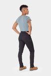Rear angled view of Christa X DIY Pant showing pocket placement and articulated knees, built for performance and ease of movement.