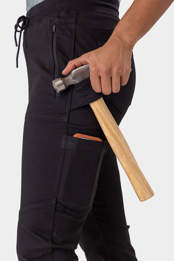 Christa X DIY Pant tool loop in use with hammer and phone pocket, designed for hands-on work with practical storage solutions.