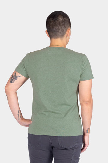 Back view of a woman wearing the Dovetail Workwear GO TO™ Crew Neck Tee Shirt in Agave Green, showcasing the relaxed fit and cotton jersey blend fabric.