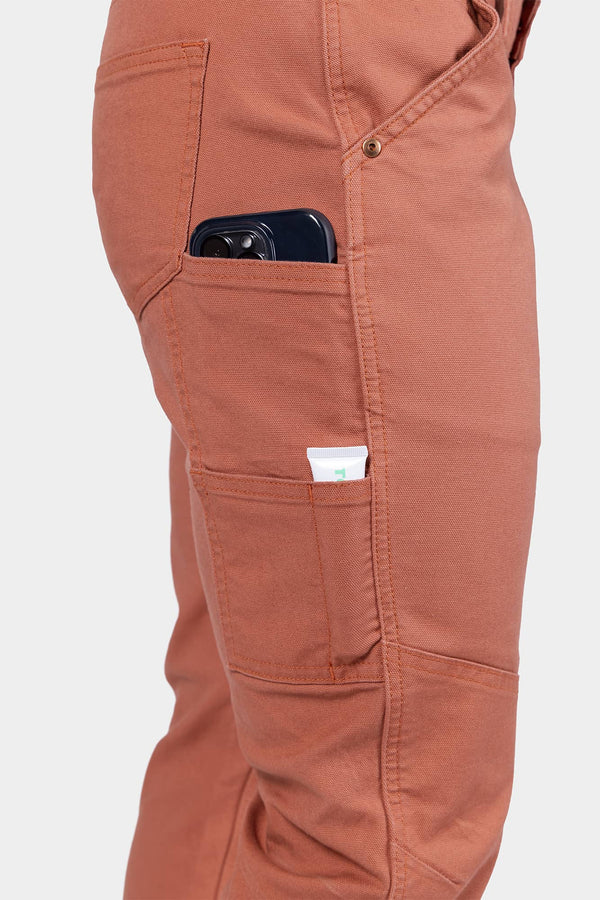 Side view detail of GO TO™ Stretch Canvas Pant in Terracotta by Dovetail Workwear, showing multiple pockets and storage capability